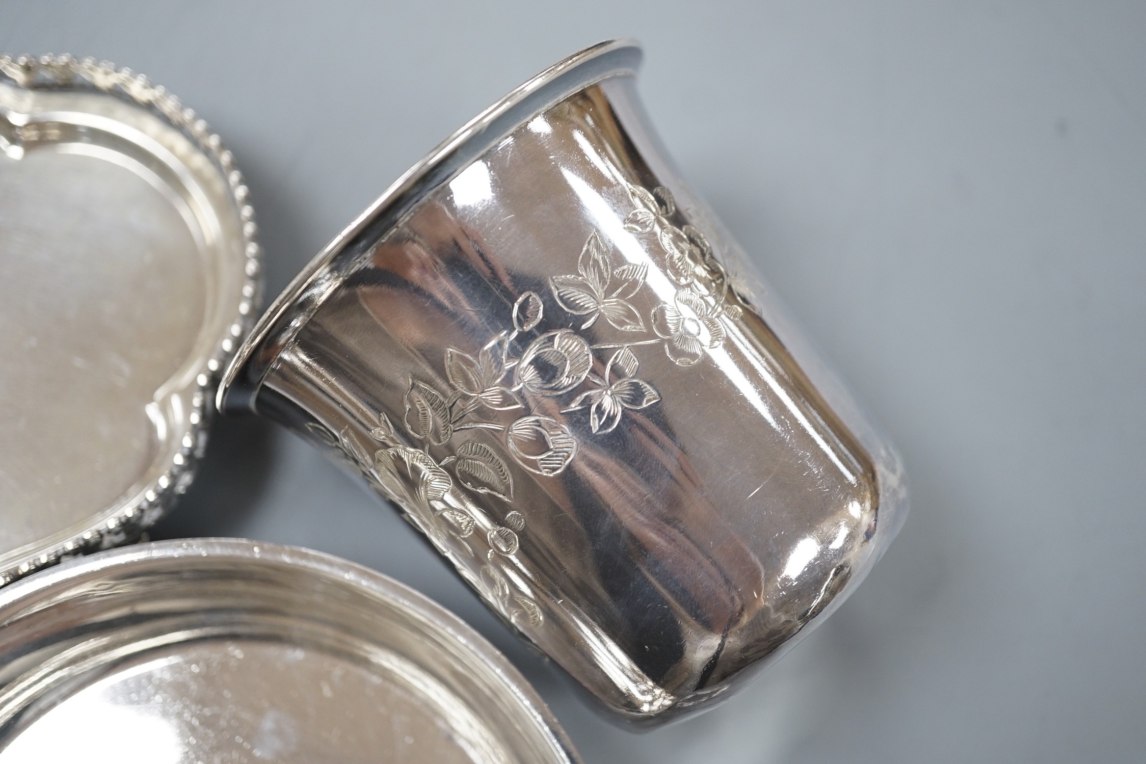 An engraved French white metal beaker, 81mm, a similar two handled shallow bowl by Risler and a modern Italian white metal snuffers stand, gross 13.5oz.